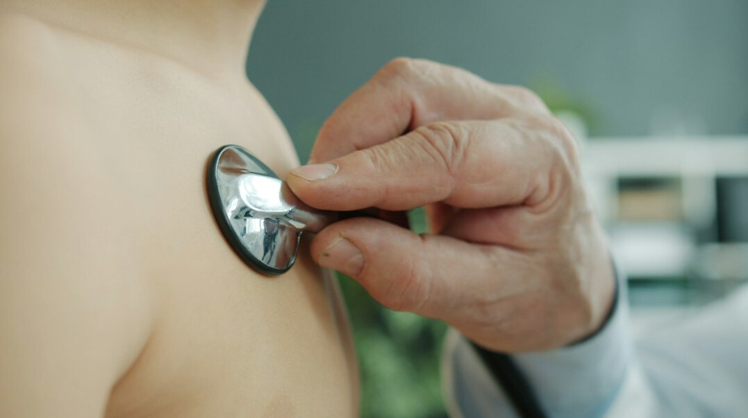 Doctor performing a health check on an employee